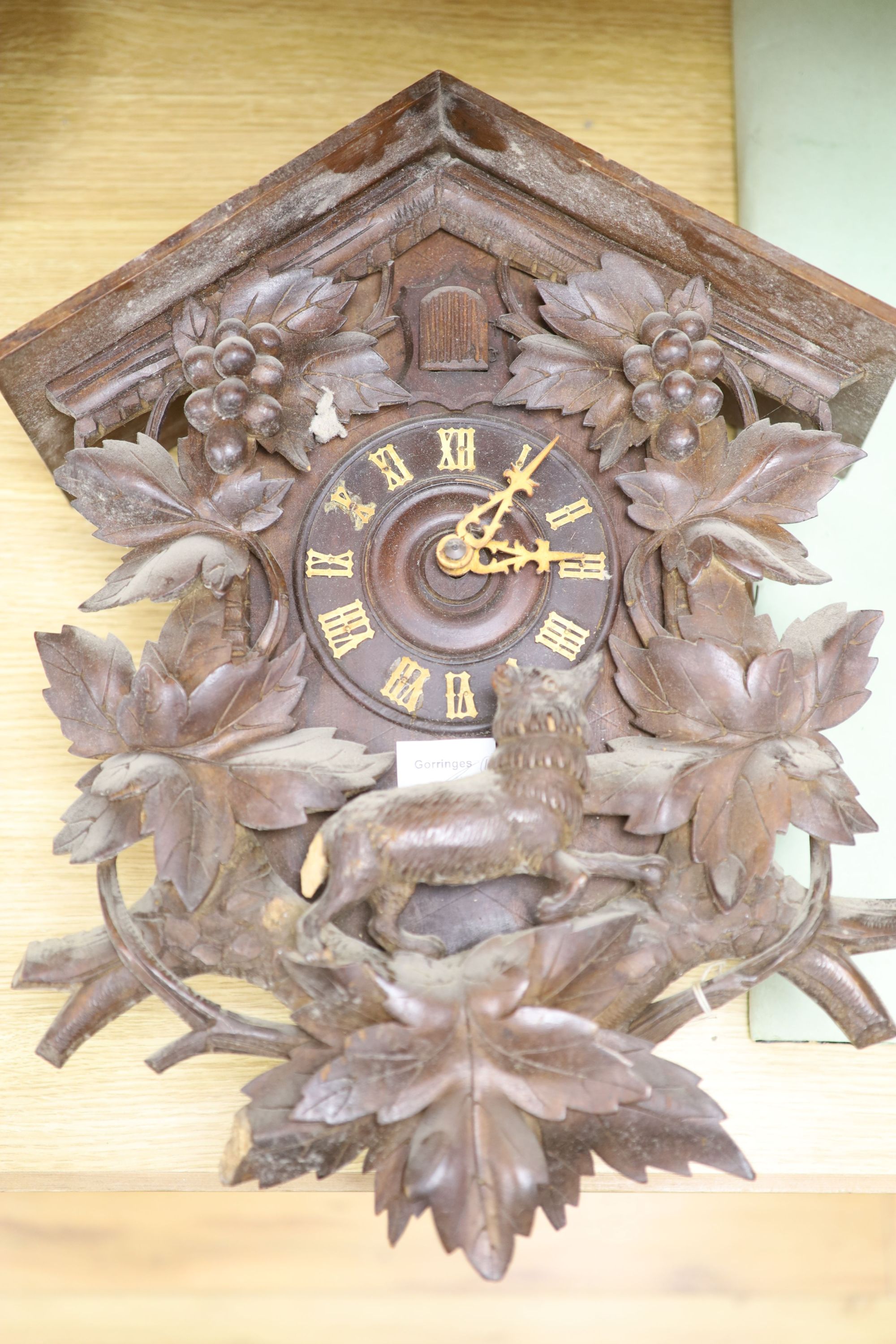 A Black Forest cuckoo wall clock, late 19th century, 47.5cm high, additional associated parts